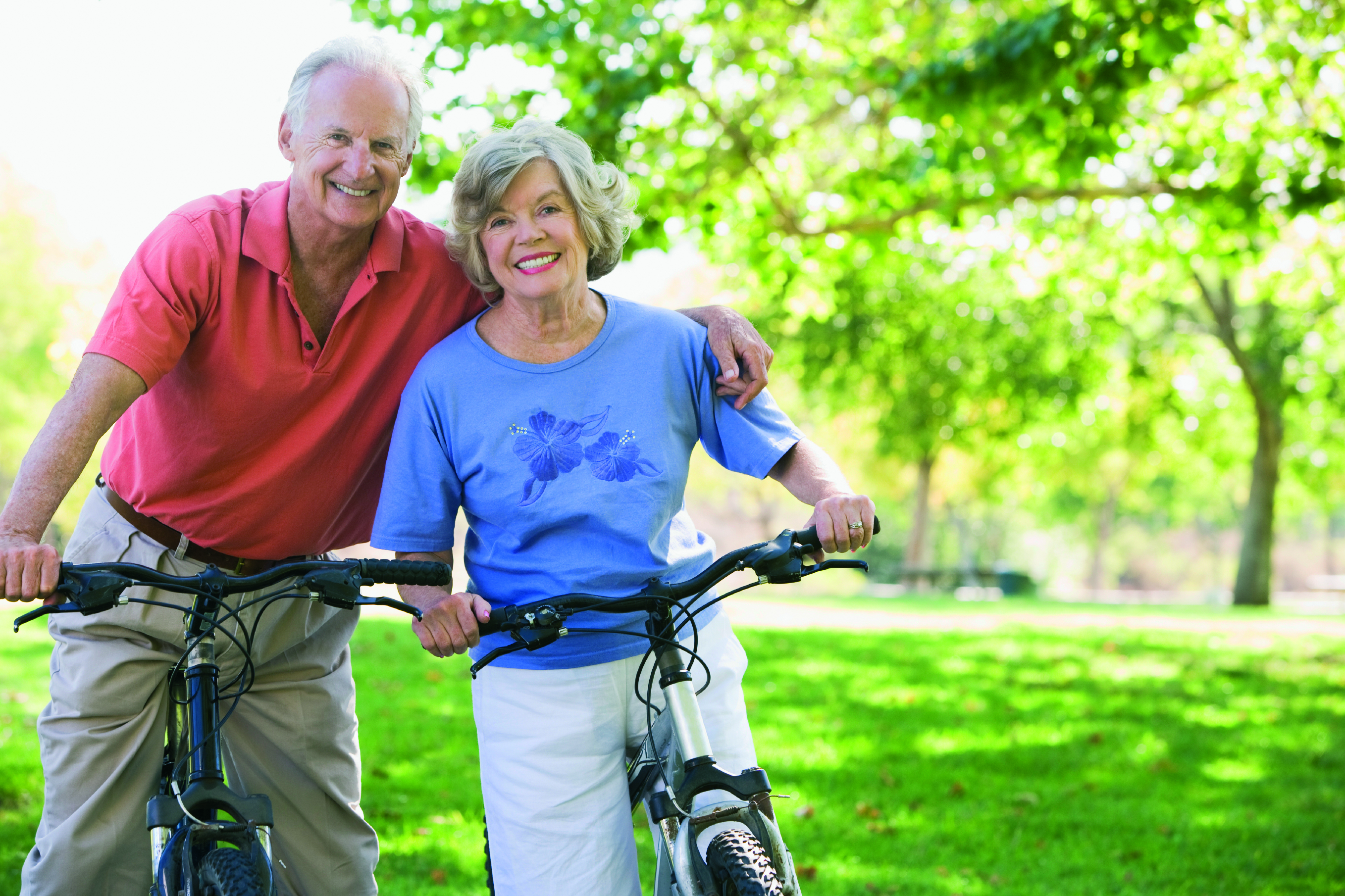 elderly couple on bikes